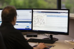 Rohrich team member on computer