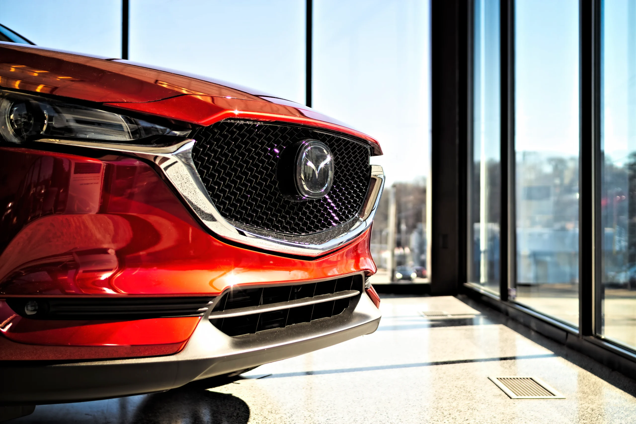 front of red Mazda car, reliable car