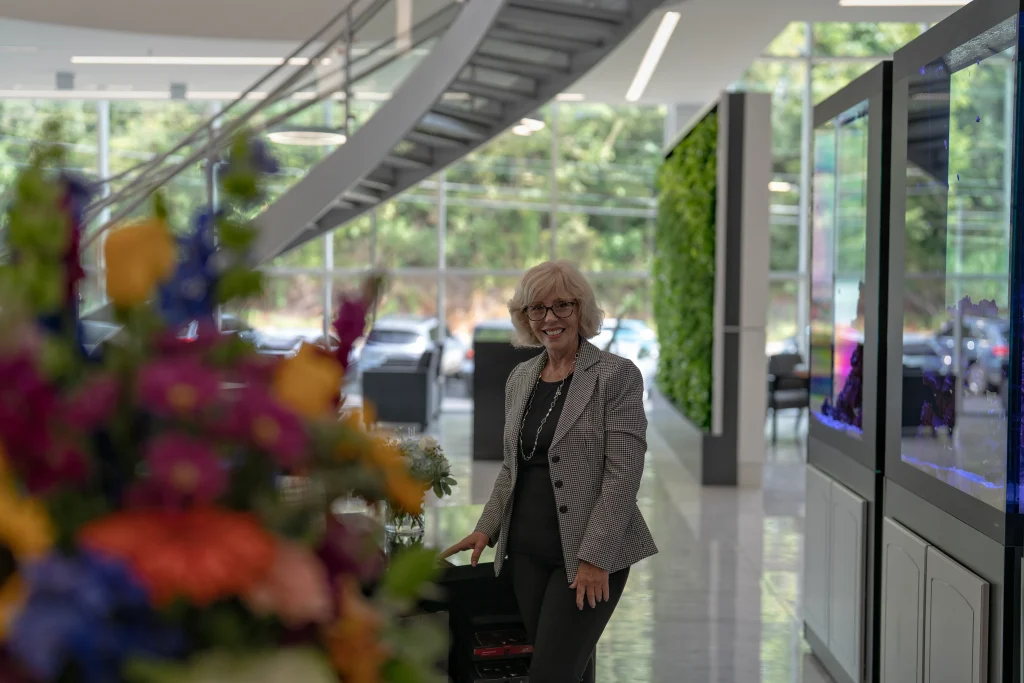 Friendly Rohrich Lexus employee standing in the showroom